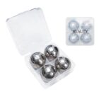 Four metallic soccer ball-shaped objects in a plastic case labeled BEAUTY.