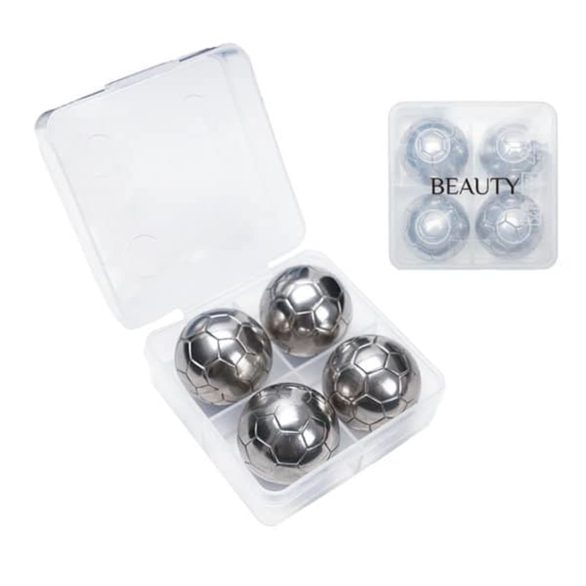Four metallic soccer ball-shaped objects in a plastic case labeled BEAUTY.