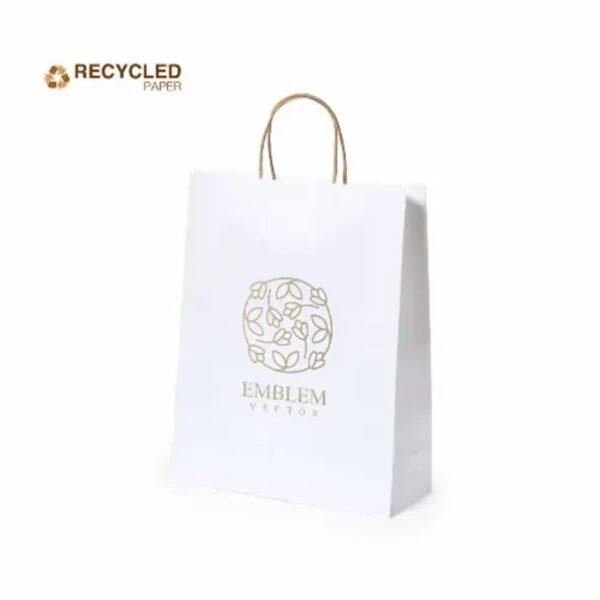 White recycled paper bag with gold handles and a floral emblem design on the front.