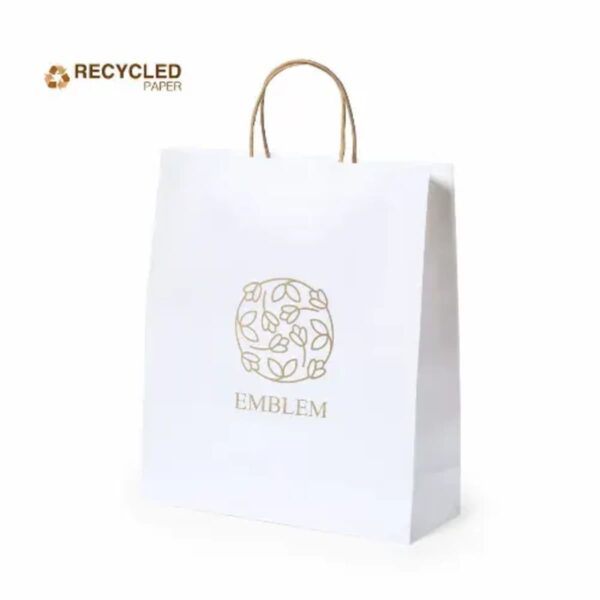 White recycled paper shopping bag with brown handles and gold EMBLEM design on front.