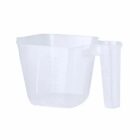Clear plastic measuring cup with handle, featuring measurement markings on the side.