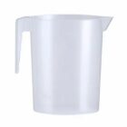 Clear plastic measuring jug with a handle and spout on a white background.