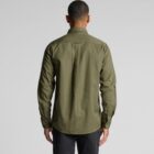 Man wearing an olive green long-sleeve shirt, shown from the back against a plain background.