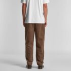 Person facing away, wearing a white T-shirt and brown corduroy pants against a plain background.