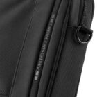 Close-up of a black fabric bag with a zipper and ANTONIO MIRO label.
