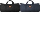 Two cylindrical duffel bags, one black and one navy, with handles and a small patch on each.
