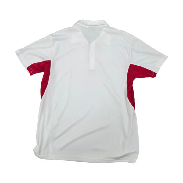 Back view of a white polo shirt with red side panels