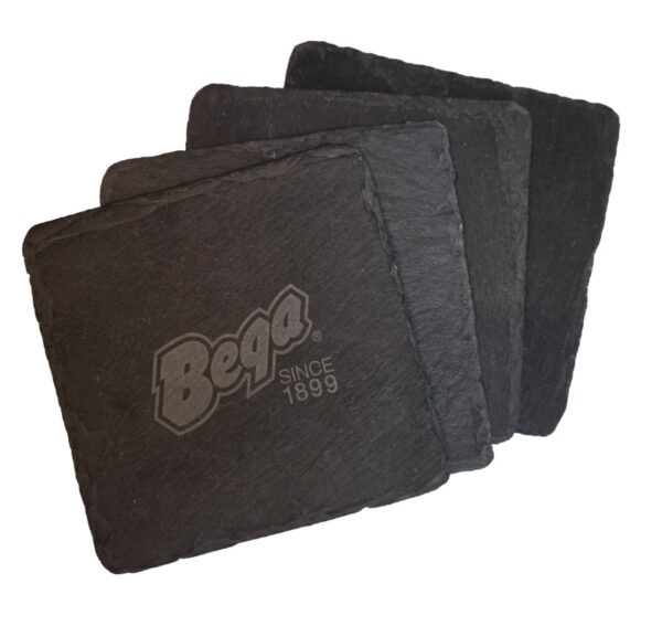 Four black custom mouse pads with the Bega logo