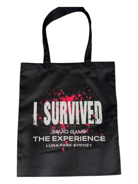 Black tote bag with I Survived Squid Game The Experience printed on it