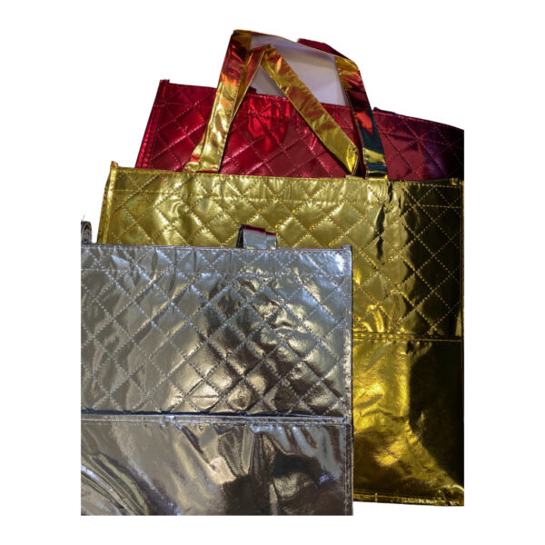 Three shiny, quilted tote bags in gold, silver, and red