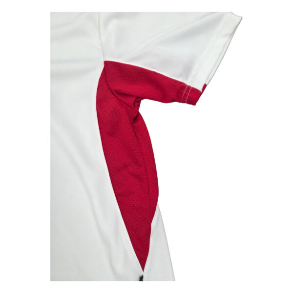 close up of the side of a polo shirt with red linings