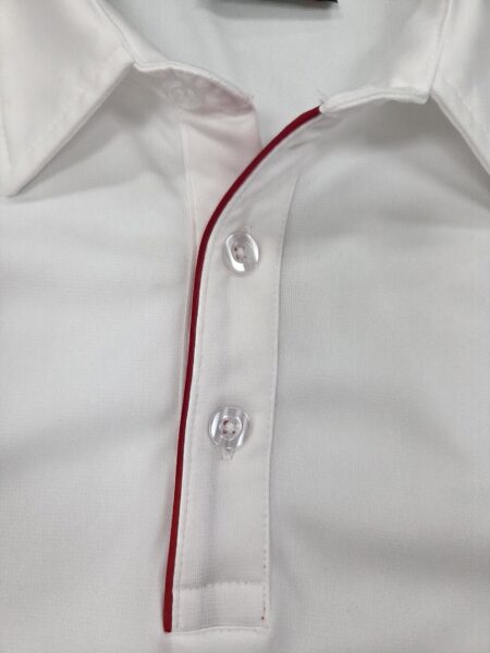 collar part of a white polo shirt with red lining