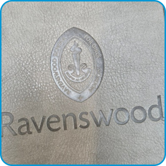 Ravenswood logo and crest embossed on textured grey material.