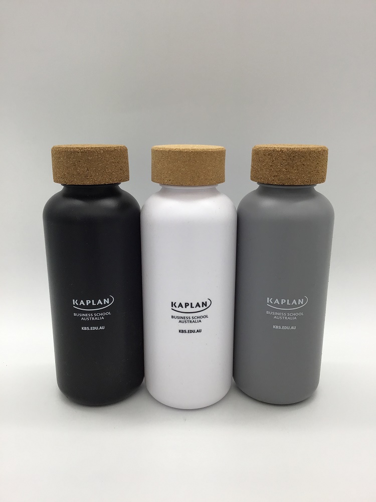 Three bottles with cork lids in black, white, and gray, featuring a Sedex Number on KAPLAN.