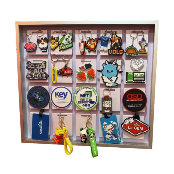 different shape of keyrings in a wooden box