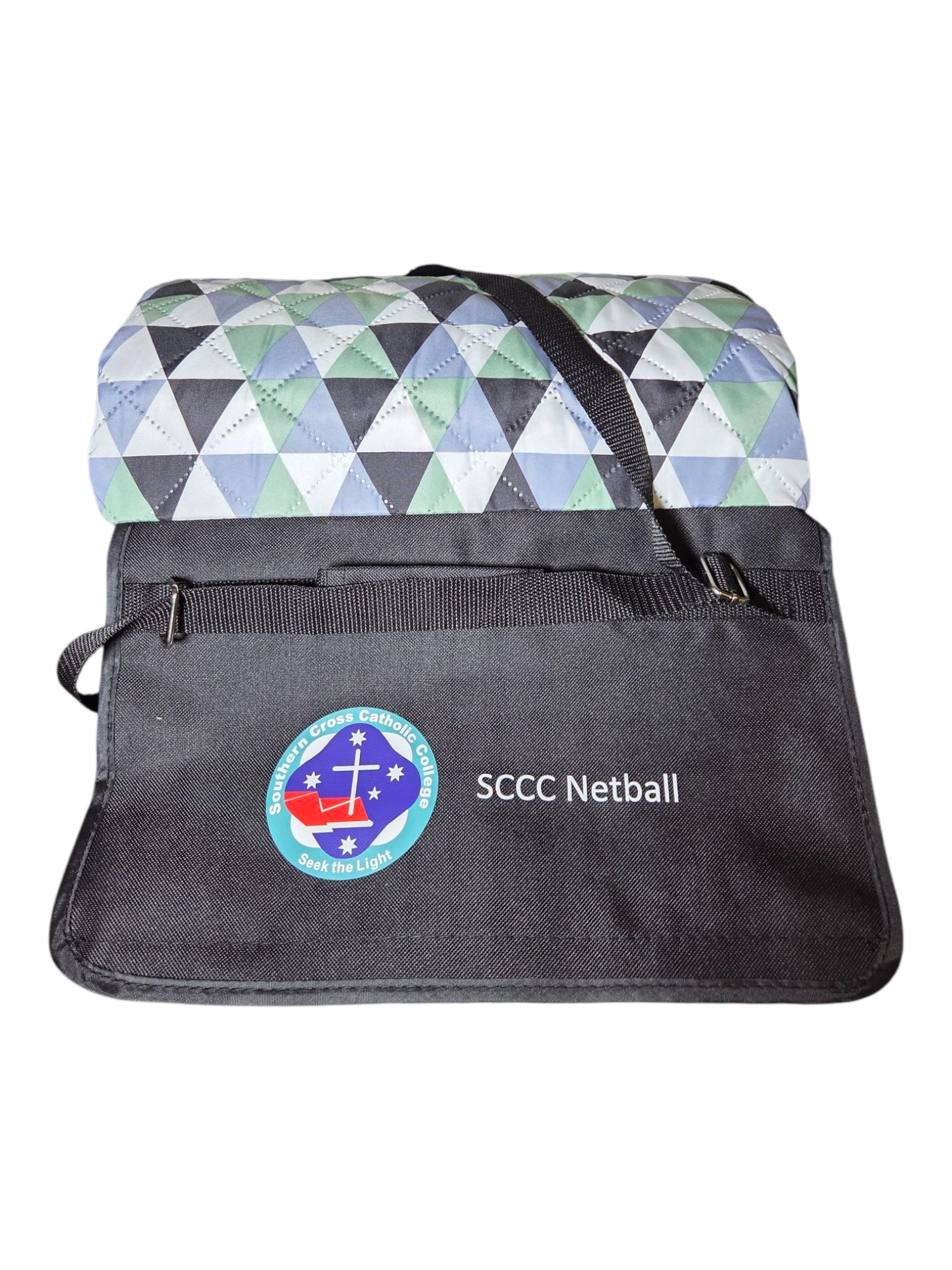 Folded geometric picnic rug in a black case, perfect as branded promotional materials for SCCC Netball.