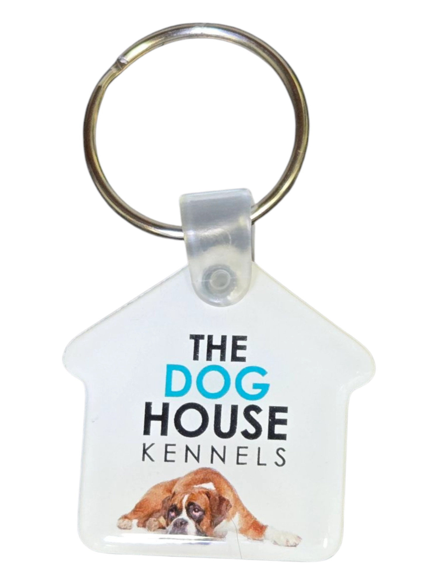 House-shaped keychain, ideal for corporate gifts, features The Dog House Kennels and a sad bulldog.
