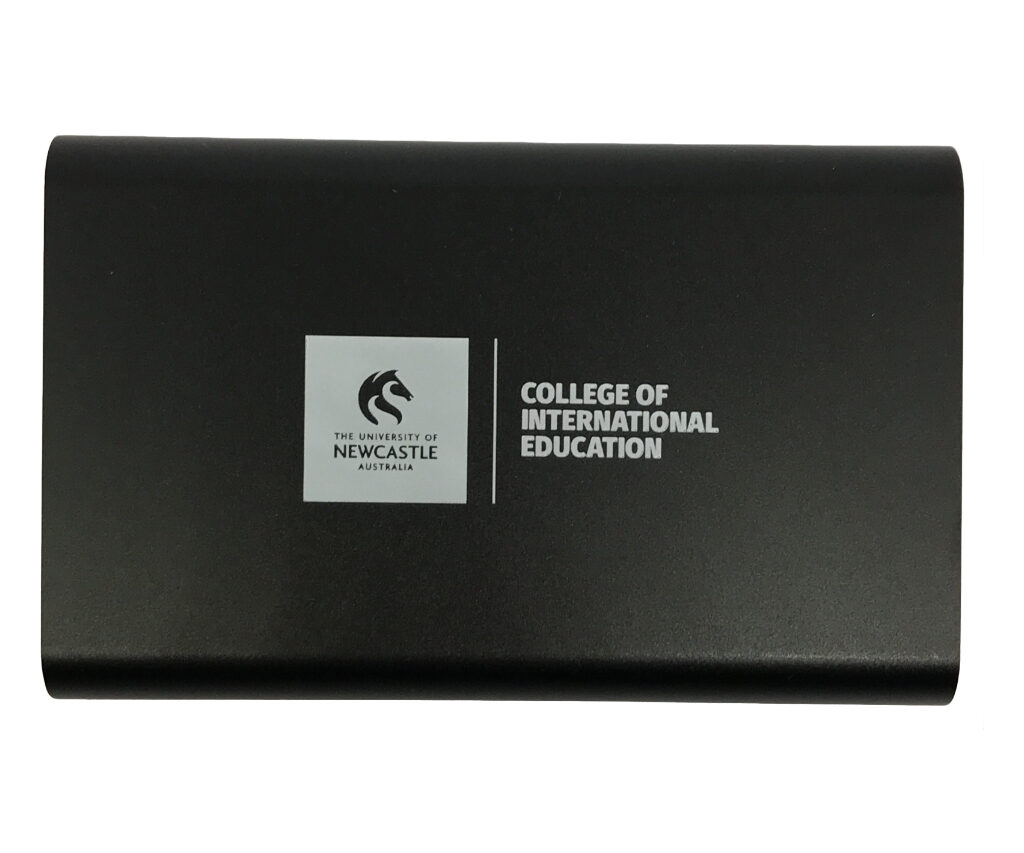 black powerbank printed with CIE and Universty of Newcastle logo