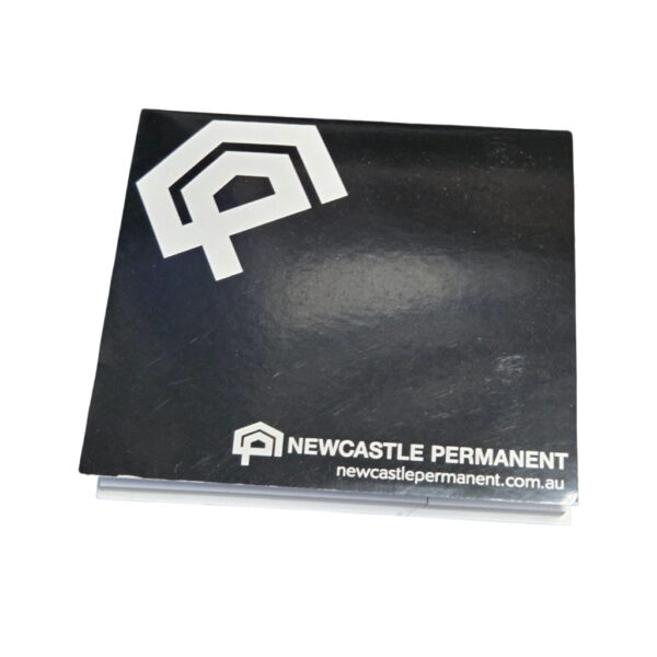 black cover of a sticky notepad with logo of Newcastle Permanent