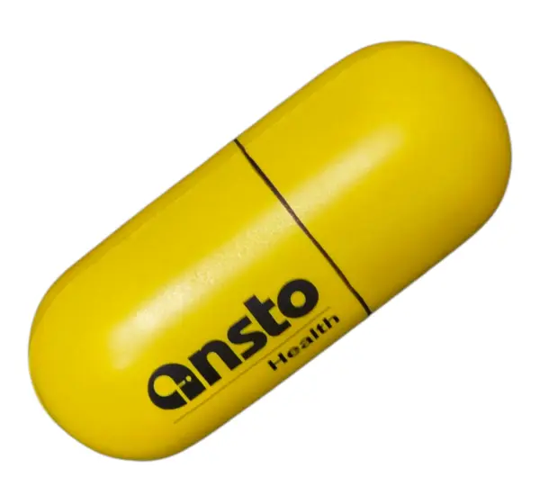 yellow stress ball shaped as a capsule with logo