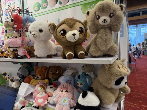 different stuffed toys in a shelf