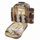 Open picnic backpack with plates, cups, cutlery, napkins, and a rolled blanket inside.