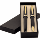 Two black and gold pens in a black gift box with the lid placed beside it.