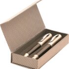 Two pens in a patterned gift box with the lid open.