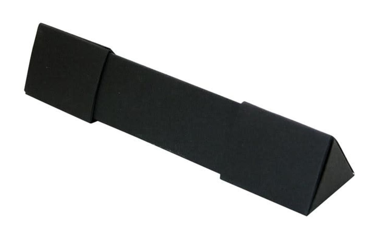 A black, rectangular foam martial arts kick pad with angled ends.