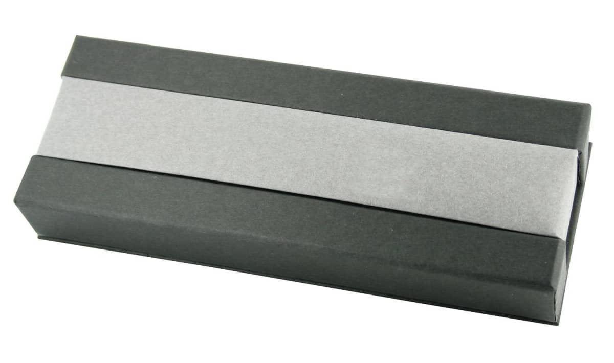 A rectangular gift box wrapped in black and silver paper.