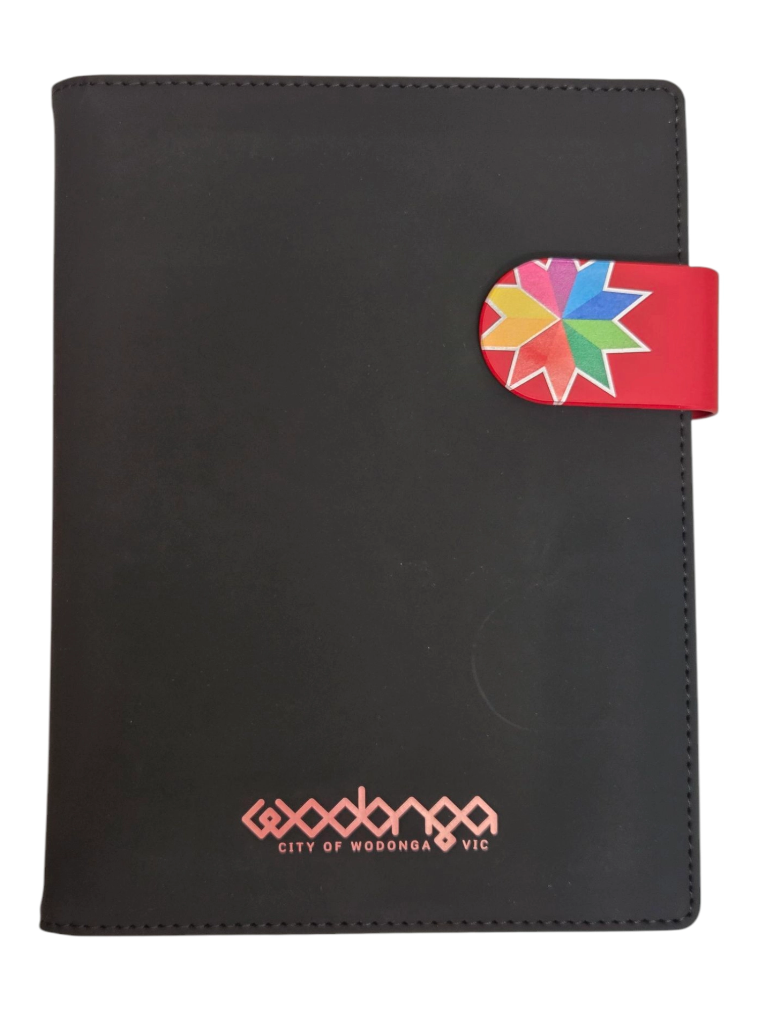 Black notebook with a colorful geometric design and City of Wodonga VIC on the cover.