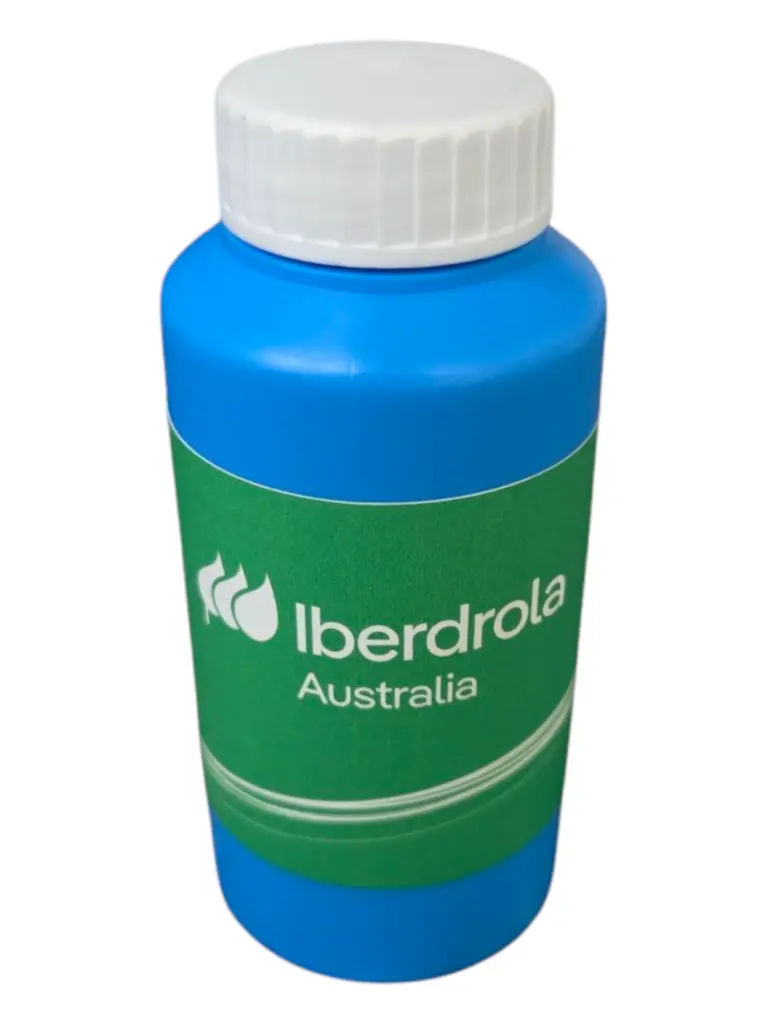 Blue bubble blower with a white lid and a green Iberdrola Australia label.
