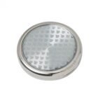 Round silver and glass tea strainer with a patterned mesh surface.