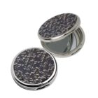 Round compact mirror with a black and silver marbled pattern, shown open and closed.