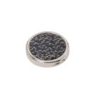 Round silver and black patterned compact case on a white background.