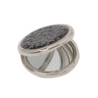 Silver compact mirror with a black patterned lid, partially open to show the mirror inside.