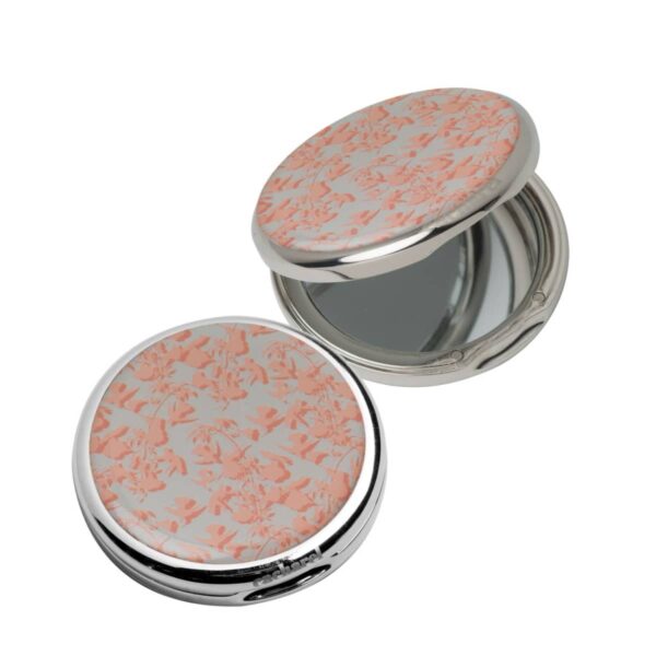 Round compact mirror with pink floral pattern, one open showing the mirror inside.