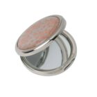 Round, silver compact mirror with pink floral pattern, open to show its two mirrors.
