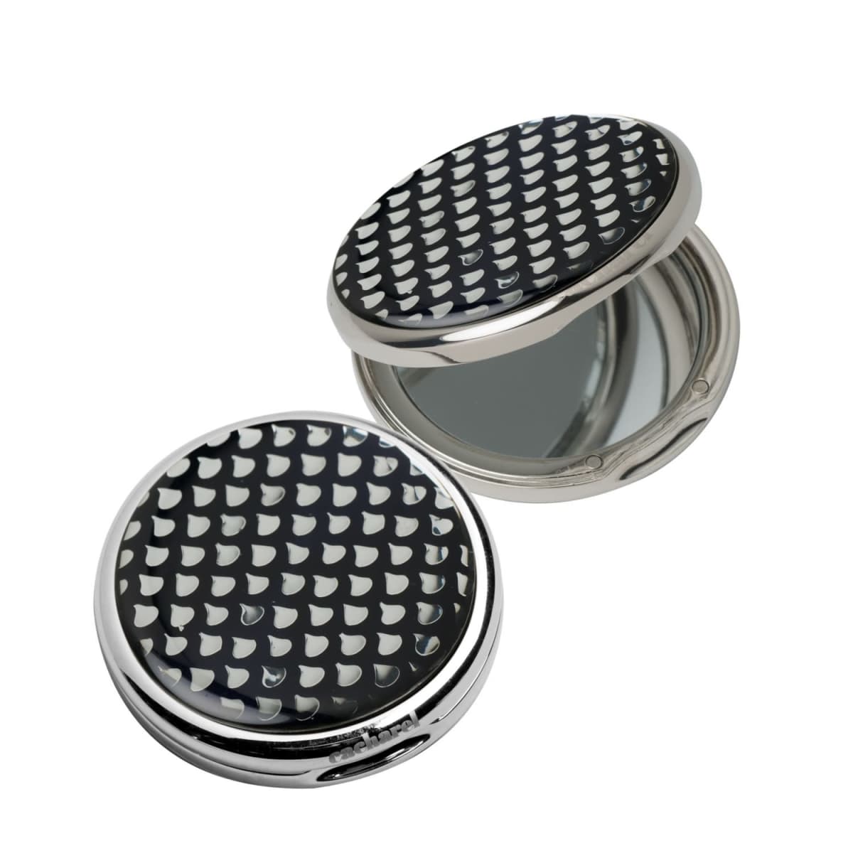 Two round compact mirrors with black and white patterned lids, one open and one closed.