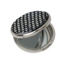 Open compact mirror with a black and white patterned lid on a white background.