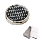 Round silver compact mirror with a black patterned lid, shown with an open white box.