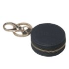 Round black zippered keychain pouch with gold keyring and clasp.