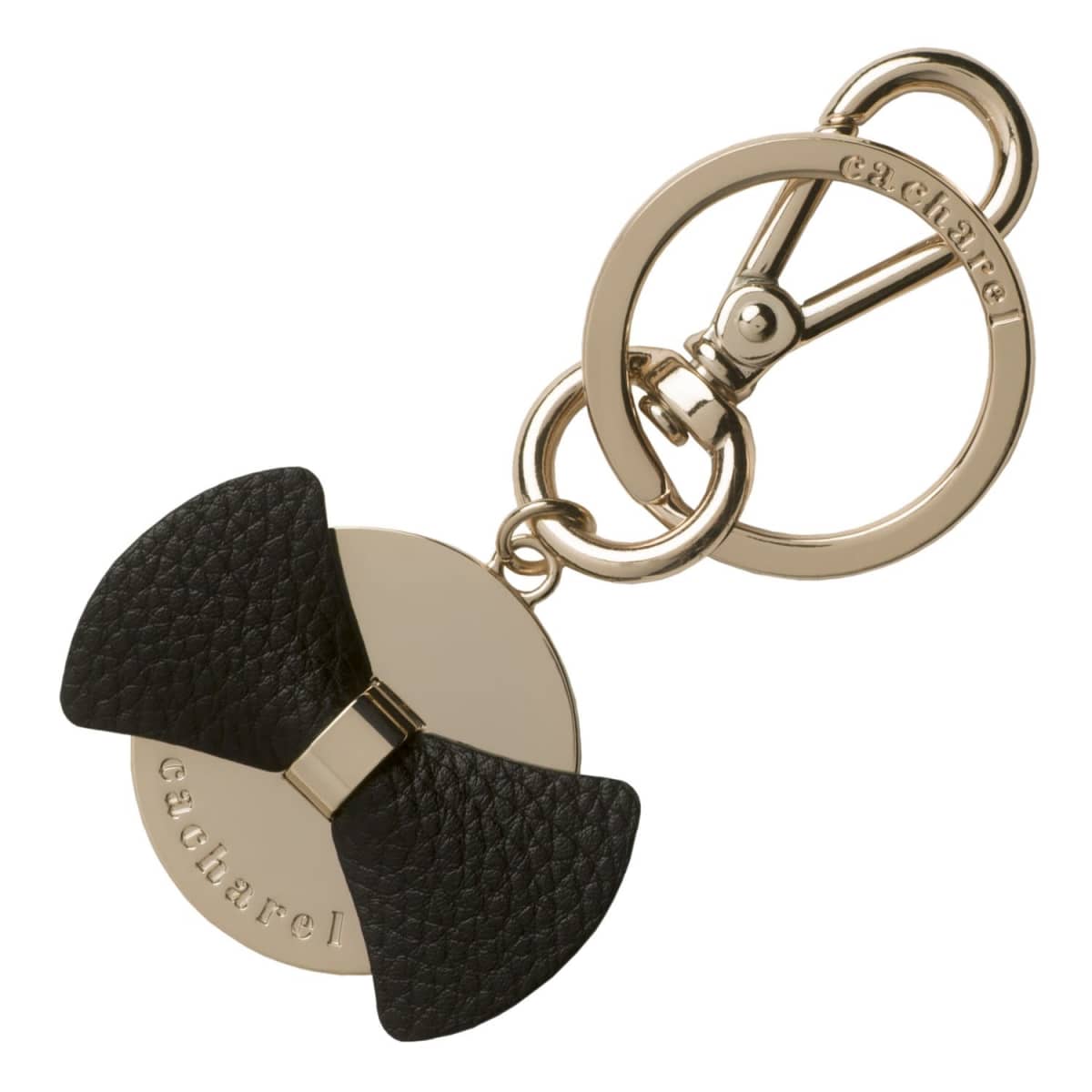 Gold keychain with a black textured bow and engraved Cacharel branding.