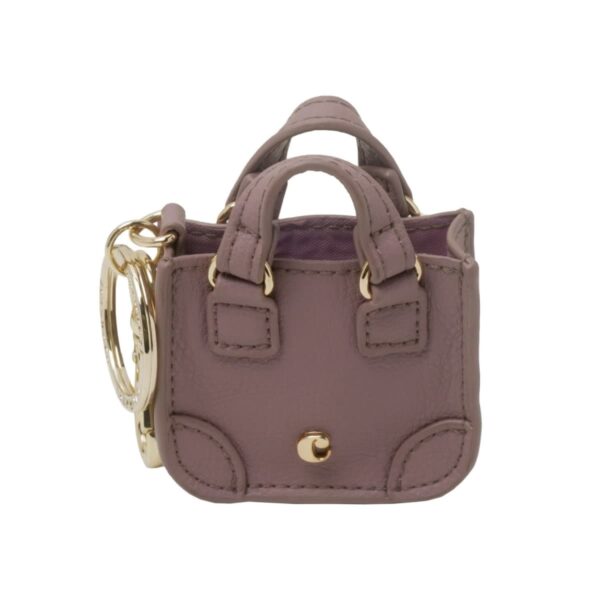 Small mauve handbag keychain with gold hardware and double handles.