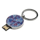 Round keychain with a floral design and a built-in USB flash drive.