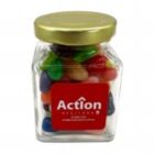 A jar of colorful jelly beans with a gold lid and a red Action label on the front.