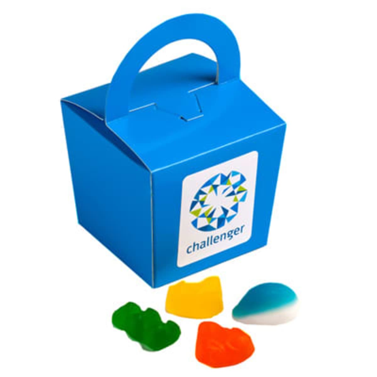 Blue gift box with handle and four colorful gummy candies in front of it.