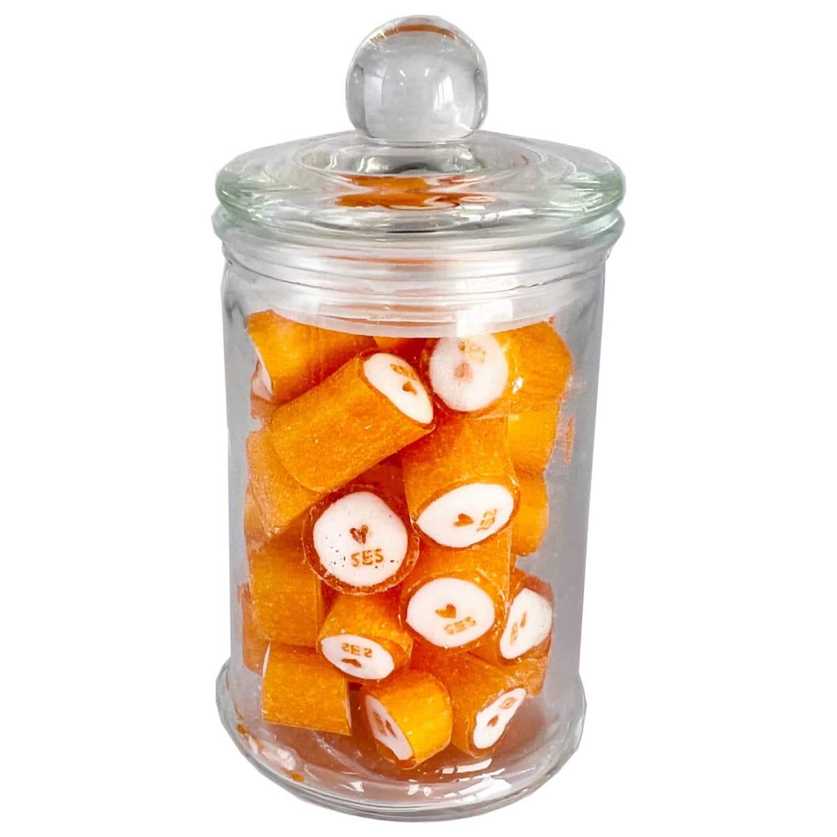 A glass jar filled with orange hard candies, some showing a heart and SES. inside.