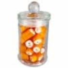 Glass jar filled with orange and white candy sticks, topped with a clear lid.