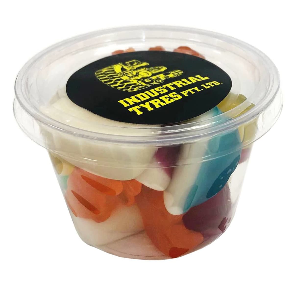 A clear plastic tub of colorful gummy candies labeled Industrial Tyres Pty. Ltd. on the lid.
